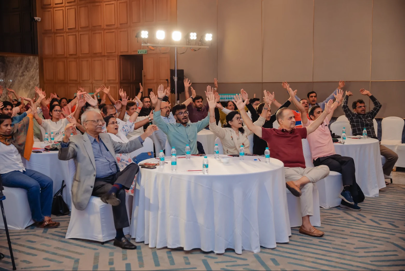 Business team engaged in a goal-focused Wellness Vibe workshop